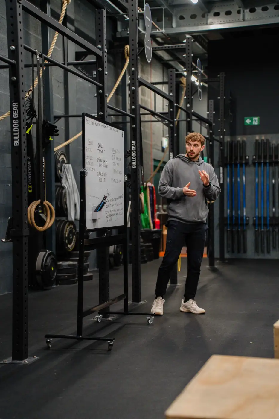 Coach explaining the workout on the whiteboard at Coastline CrossFit, Southport